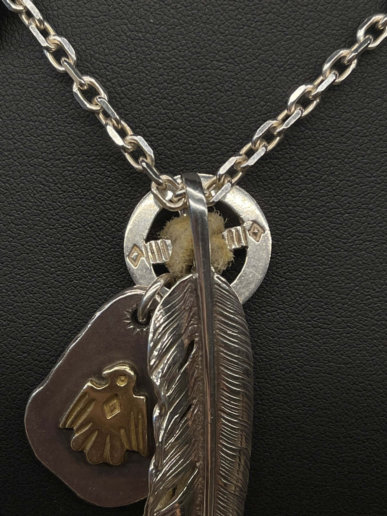 Goros Gold Tip Feather with Leather Cord Setup