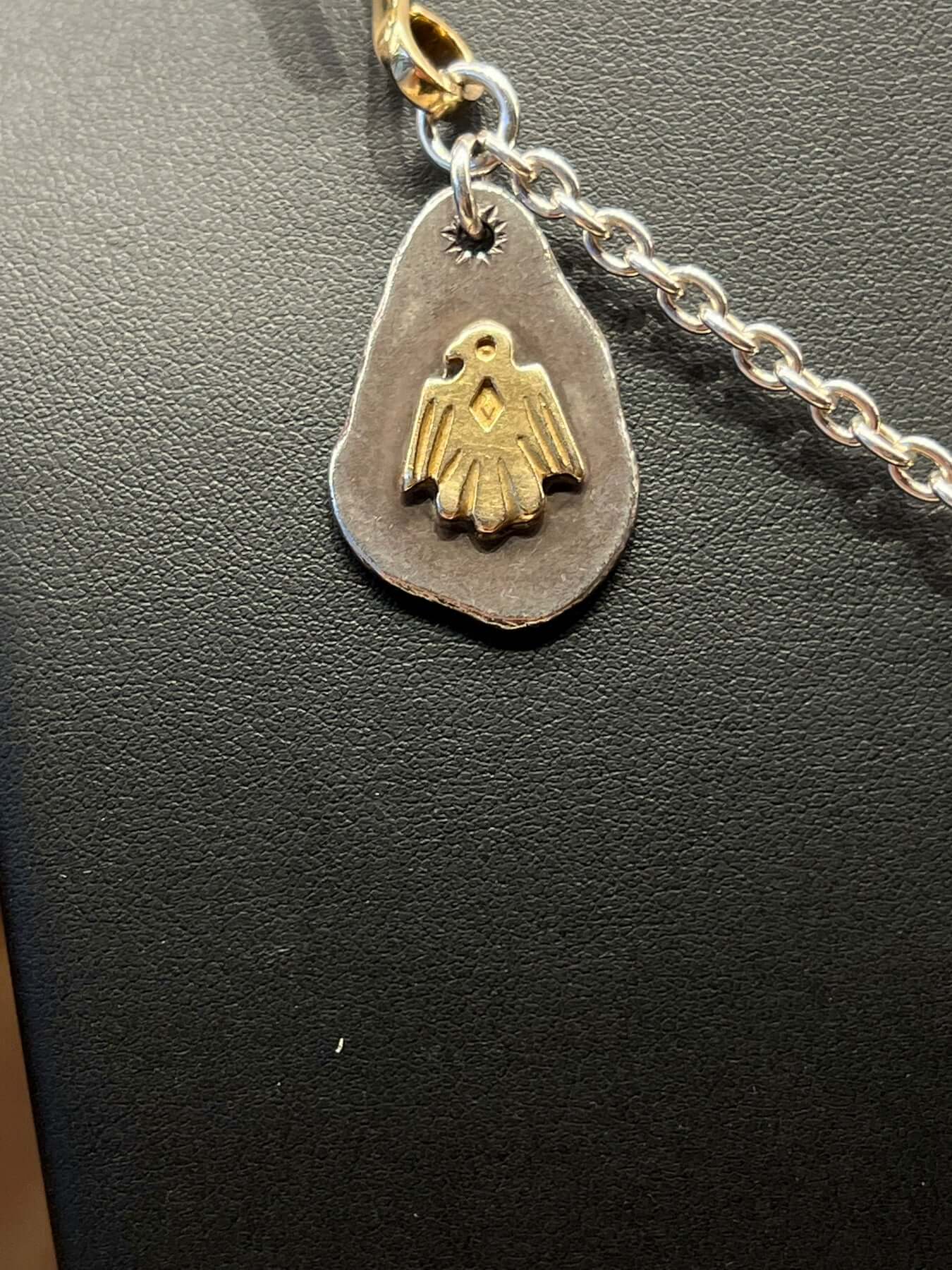 Goros Feather With Silver Claw With Metal Pendant Setup