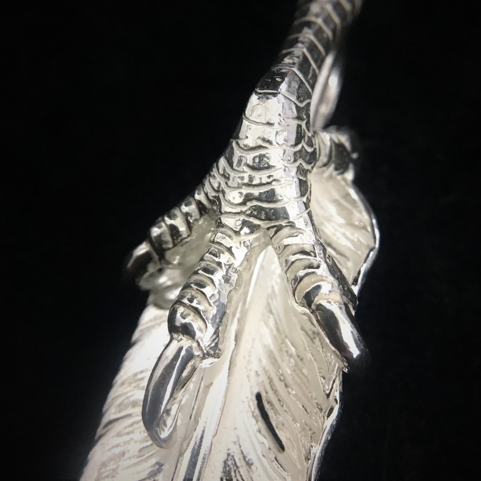 Feather with Silver Claw - Facing Left | Goro&#39;s Authorized Dealer