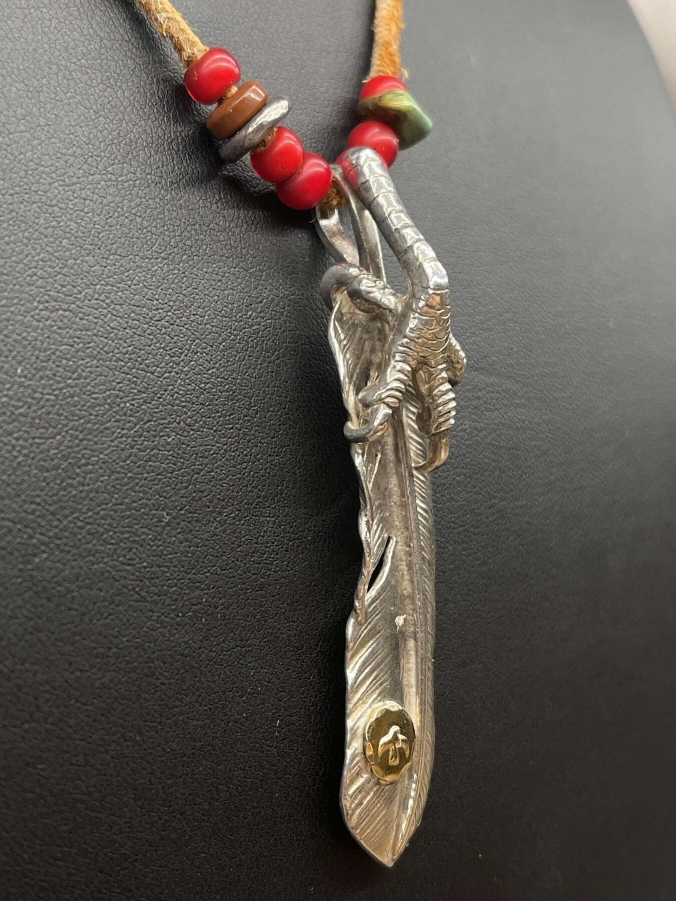Goros Feather With Silver Claw and Leather Cord Setup