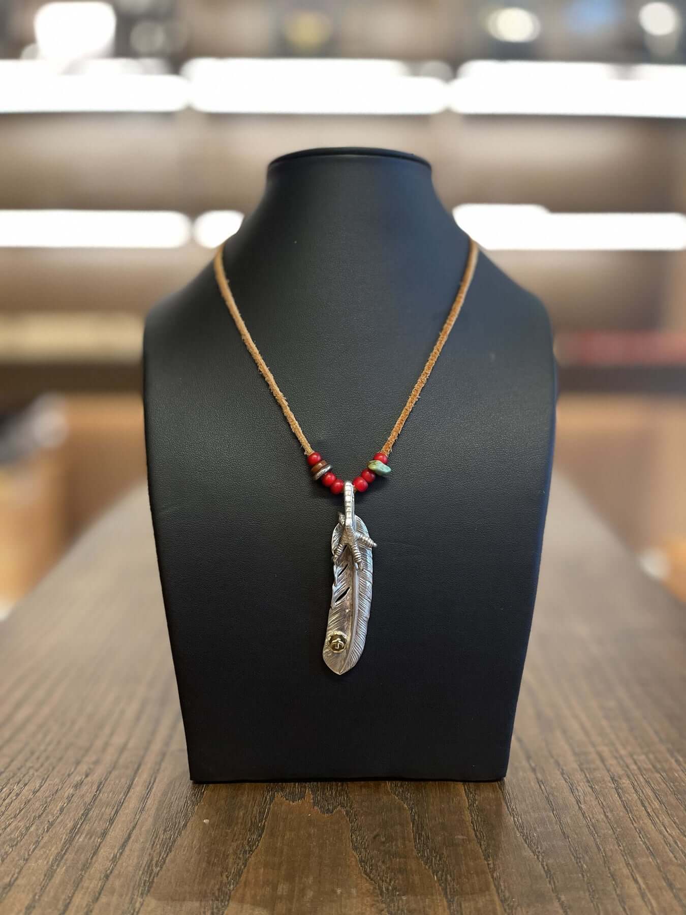 Goros Feather With Silver Claw and Leather Cord Setup
