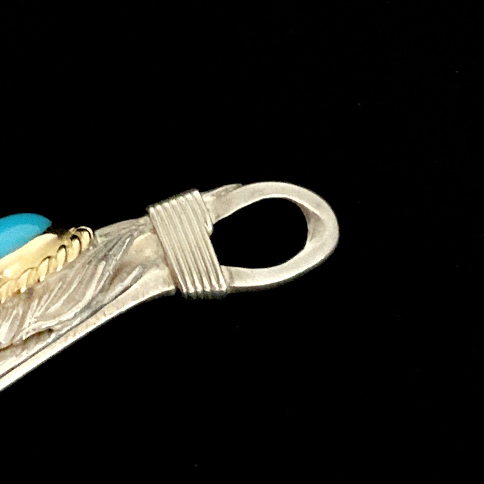 Turquoise Feather Silver Rope - Facing Left | Goro&#39;s Native Feather Authorized Dealer