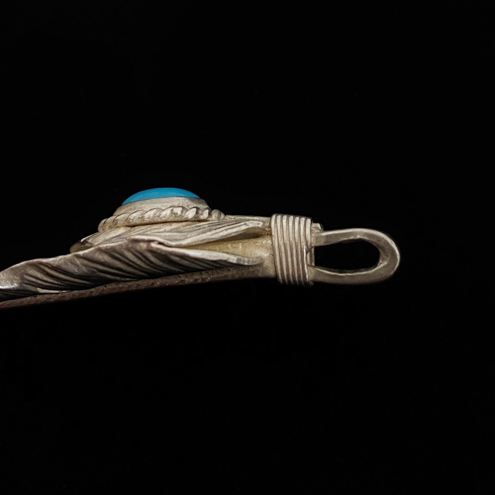 Turquoise Feather Silver Rope - Facing Left | Goro&#39;s Feather Authorized Dealer